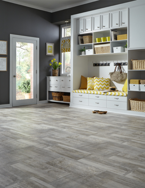 A living space with gray laminate flooring